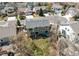 Aerial shot showcasing a two-story home's backyard, featuring a patio, seating, hot tub, and a well-manicured lawn at 18995 E Bellisario Creek Pl, Parker, CO 80134