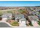 Beautiful aerial view of a residential home situated on a landscaped lot and backing to open green space at 18995 E Bellisario Creek Pl, Parker, CO 80134