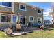 Exterior patio with outdoor seating, perfect for entertaining, located off the back of a well-maintained two-story home at 18995 E Bellisario Creek Pl, Parker, CO 80134