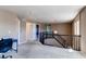 Upstairs landing with carpet, natural light, and stairwell access at 18995 E Bellisario Creek Pl, Parker, CO 80134