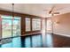 Sun-filled living room with large windows and access to the outdoor patio at 18995 E Bellisario Creek Pl, Parker, CO 80134
