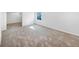 Finished basement area with neutral carpet and natural light from window at 4658 E 107Th Ave, Thornton, CO 80233