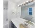 Bright bathroom with shower and vanity featuring a large mirror and light fixture at 4658 E 107Th Ave, Thornton, CO 80233