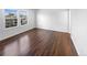 Bright bedroom featuring lustrous hardwood flooring and well-lit by the windows at 4658 E 107Th Ave, Thornton, CO 80233