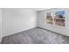 Cozy bedroom featuring large window for natural light and backyard views at 4658 E 107Th Ave, Thornton, CO 80233