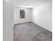Bright bedroom with plush carpet and a view of the natural exterior at 4658 E 107Th Ave, Thornton, CO 80233