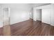 Clean bedroom with spacious closet, ensuite access, and wood flooring at 4658 E 107Th Ave, Thornton, CO 80233