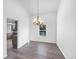 Light-filled dining area featuring hardwood floors and elegant chandelier at 4658 E 107Th Ave, Thornton, CO 80233