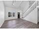 Bright living room featuring vaulted ceilings, skylights, and modern finishes at 4658 E 107Th Ave, Thornton, CO 80233