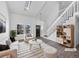 Bright living room featuring vaulted ceilings, skylights, and modern finishes at 4658 E 107Th Ave, Thornton, CO 80233