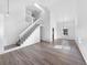 Open-concept living area with vaulted ceilings, staircase, and ample natural light at 4658 E 107Th Ave, Thornton, CO 80233