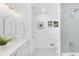 Modern bathroom with hexagon floor tile, white cabinets and herringbone shower tile at 545 S Harrison Ln, Denver, CO 80209