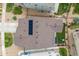Aerial view of neighborhood featuring solar panels, manicured lawns, and mountain backdrop at 9375 Joyce Way, Arvada, CO 80007