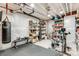 Finished basement with work out area, black floors, white walls and storage at 9375 Joyce Way, Arvada, CO 80007