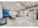 Unfinished basement, offering flexible layout, with drop ceiling and sports equipment at 9375 Joyce Way, Arvada, CO 80007