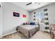 Bedroom with a neutral palette, modern furnishings, ceiling fan, and a window at 9375 Joyce Way, Arvada, CO 80007
