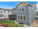Exterior shot of backyard featuring hot tub, artificial turf, and patio seating at 9375 Joyce Way, Arvada, CO 80007