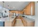 Expansive kitchen featuring a large island, stainless steel appliances, and modern cabinets at 9375 Joyce Way, Arvada, CO 80007