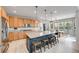 Spacious kitchen with a large island, granite countertops, and stainless steel appliances at 9375 Joyce Way, Arvada, CO 80007