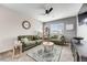 Comfortable living room with stylish furniture, a ceiling fan, and plenty of natural light at 9375 Joyce Way, Arvada, CO 80007