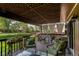 Outdoor deck featuring comfortable seating and a pergola perfect for relaxing or entertaining in style at 6687 Devinney Ct, Arvada, CO 80004