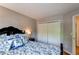Comfortable bedroom featuring stylish bedding and a spacious closet for ample storage at 6687 Devinney Ct, Arvada, CO 80004