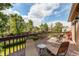 Relaxing outdoor deck with comfortable lounge chairs and views of the beautifully landscaped backyard at 6687 Devinney Ct, Arvada, CO 80004