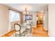 Dining room with hardwood floors, chandelier lighting and stylish table at 6687 Devinney Ct, Arvada, CO 80004