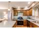Kitchen with stainless appliances and a view of the living room at 6687 Devinney Ct, Arvada, CO 80004
