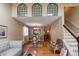 Open-concept living room and dining area with hardwood floors and natural light at 6687 Devinney Ct, Arvada, CO 80004