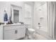 Bright bathroom with a shower and tub combination, plus a modern vanity with great lighting at 8175 Sewanee Peak St, Littleton, CO 80125