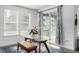 Cozy dining area with a glass table, bench seating, and natural light at 8175 Sewanee Peak St, Littleton, CO 80125