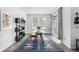 Bright dining area with a glass table, accent rug, and modern decor at 8175 Sewanee Peak St, Littleton, CO 80125