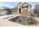Charming two-story home featuring stone accents, a well-manicured yard, and an attached two-car garage at 8175 Sewanee Peak St, Littleton, CO 80125