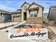Charming two-story home featuring stone accents and a well-maintained front yard at 8175 Sewanee Peak St, Littleton, CO 80125