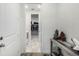 Hallway leading to laundry area and walk-in closet with stylish flooring and decor at 8175 Sewanee Peak St, Littleton, CO 80125