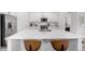 Beautiful kitchen with a large island, stainless steel appliances, and seating at 8175 Sewanee Peak St, Littleton, CO 80125
