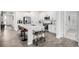 Stylish kitchen featuring modern appliances, white cabinets, and an inviting bar area at 8175 Sewanee Peak St, Littleton, CO 80125