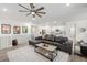 Open living area showcasing a contemporary aesthetic and seamless flow to the kitchen at 8175 Sewanee Peak St, Littleton, CO 80125