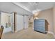 Basement bedroom with dresser and access to bath at 7999 S Blackstone Pkwy, Aurora, CO 80016