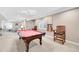 Basement recreation room with pool table and seating at 7999 S Blackstone Pkwy, Aurora, CO 80016