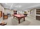 Basement recreation room with pool table and seating at 7999 S Blackstone Pkwy, Aurora, CO 80016