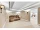 Finished basement recreation room with a large sectional sofa at 7999 S Blackstone Pkwy, Aurora, CO 80016