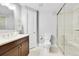 Basement bathroom with shower, toilet and vanity at 7999 S Blackstone Pkwy, Aurora, CO 80016