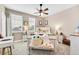 Bright bedroom with plush carpeting and ample natural light at 7999 S Blackstone Pkwy, Aurora, CO 80016