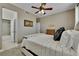Cozy bedroom with ceiling fan and en-suite bathroom at 7999 S Blackstone Pkwy, Aurora, CO 80016