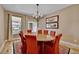 Bright dining room with a large table and chandelier at 7999 S Blackstone Pkwy, Aurora, CO 80016