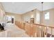 Upstairs hallway with high ceilings and natural light at 7999 S Blackstone Pkwy, Aurora, CO 80016