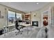 Home office with built-in shelving and fireplace at 7999 S Blackstone Pkwy, Aurora, CO 80016