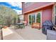 Backyard patio with seating, grill, and sliding glass door access at 7999 S Blackstone Pkwy, Aurora, CO 80016